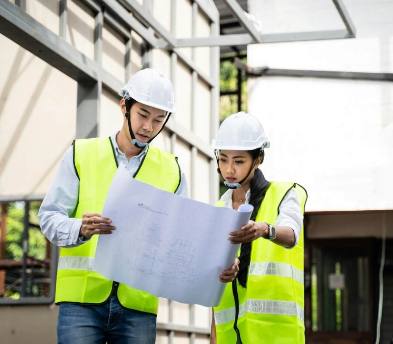 asian-colleague-workers-people-wearing-protective-safety-helmet-and-glasses-onsite-of-architecture-.jpg